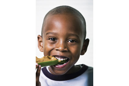 boy eating celery, peanut butter