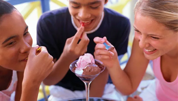 Group of kids sharing ice cream