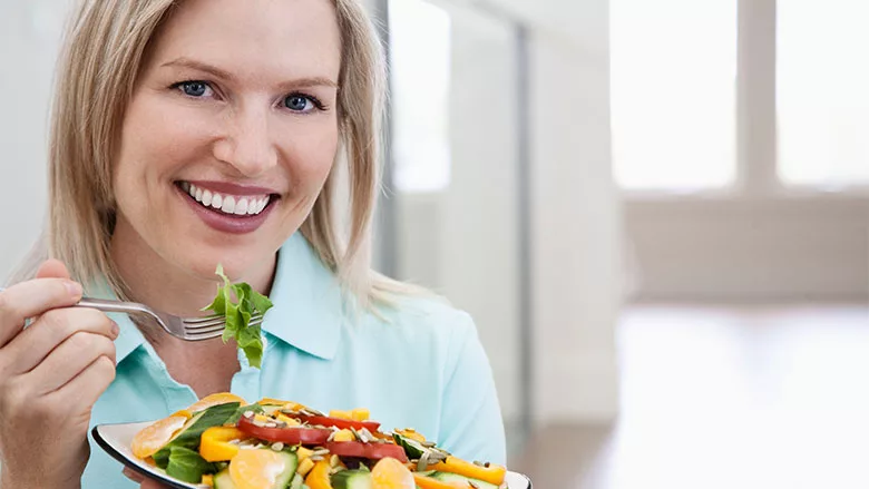 Woman Eating Salad