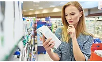 Woman Consumer Inspecting Package