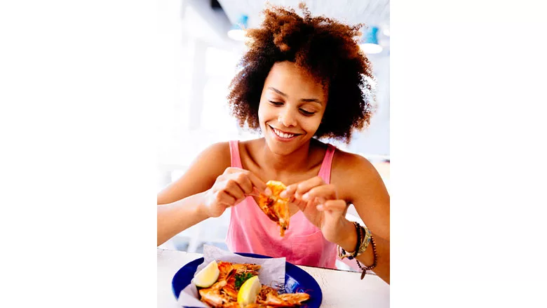 Woman Eating Shrimp