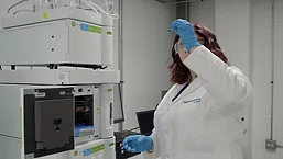Hydrosome Labs Technician inspects vial