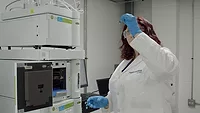 Hydrosome Labs Technician inspects vial