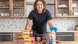 Rudis Sandos on counter with man