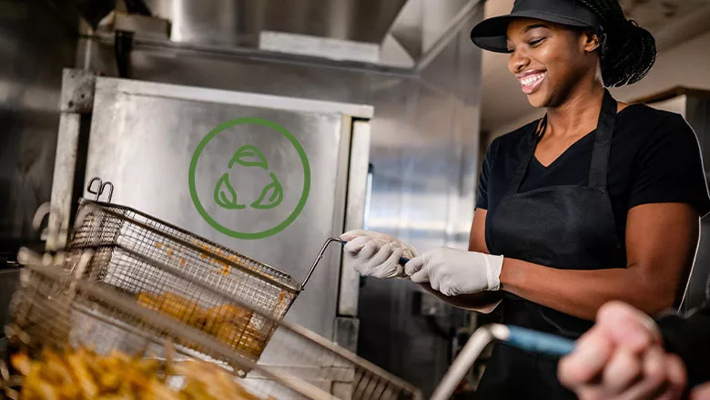 Cook preparing fried foods