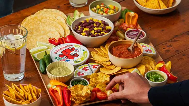 Laughing Cow Jalapeno on table with snacks