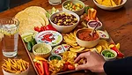 Laughing Cow Jalapeno on table with snacks