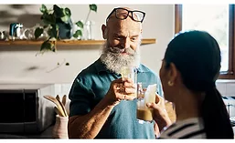 Man and Woman Cheers Health Drinks