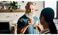 Man and Woman Cheers Health Drinks