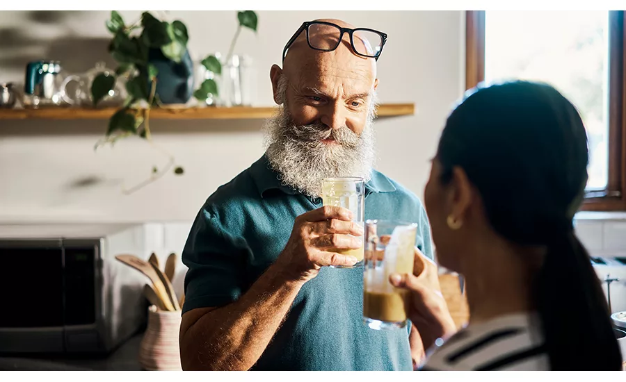 Man and Woman Cheers Health Drinks