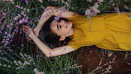 Women Laying Among Flowers 