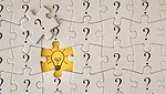 Puzzle Pieces with Lightbulb
