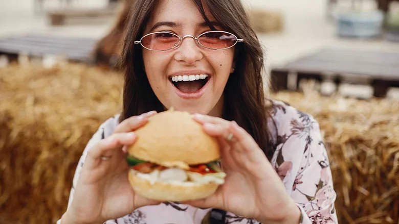Woman Holding Sandwich