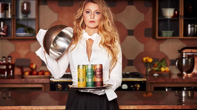 Woman Holds Betty Booze Cans on Tray