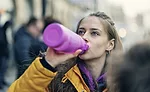 Person drinking sports beverage