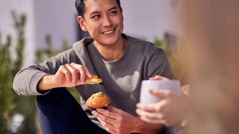 Person Eating Muffin