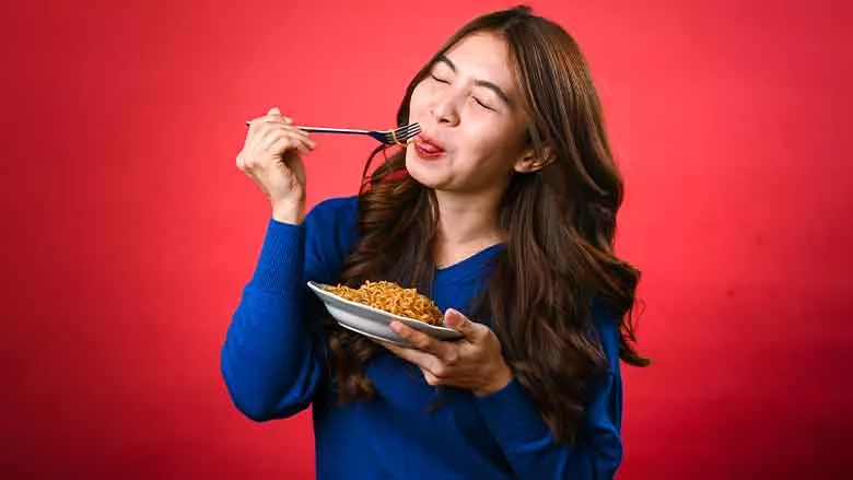 Person Tasting Noodles