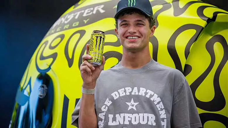 Lando Norris holding Monster Energy drink