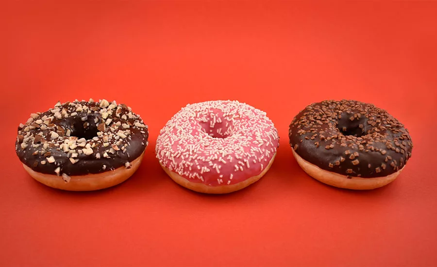 Three Donuts Orange Background