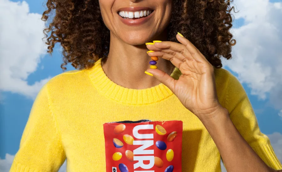 Person eating Unreal PB Snacks