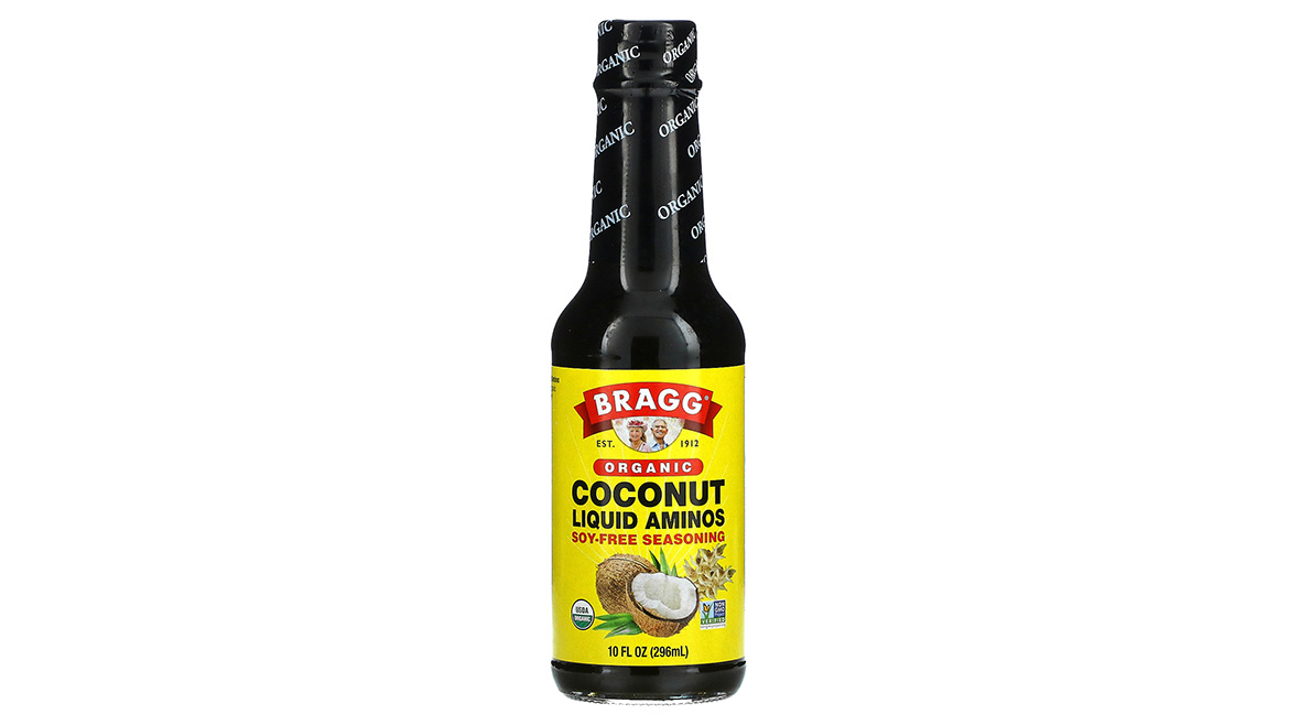Bottle of organic coconut liquid aminos seasoning, a soy-free condiment and flavor enhancer used as an alternative to traditional soy sauce.
