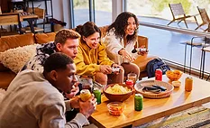 People Snacking Around Table