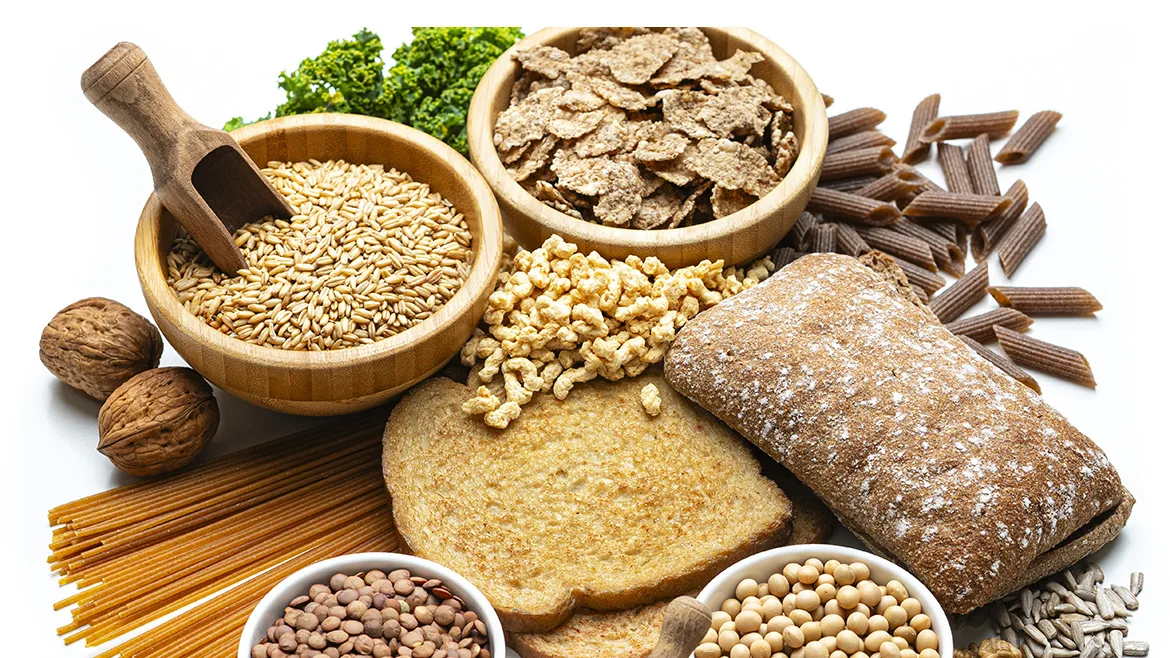 Whole-Grain Foods Rich in Dietary Fiber Whole-grain foods including bread, pasta, oats, cereal, and legumes.