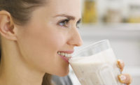 Girl drinking nutritional shake