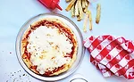 Incorporating full servings of veggies in classic foods, such as pizza, help bridge the gap between what kids should eat and what they want to eat
