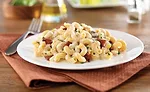 Creating gluten-free pasta requires a precise balance of flours from sources such as corn and rice