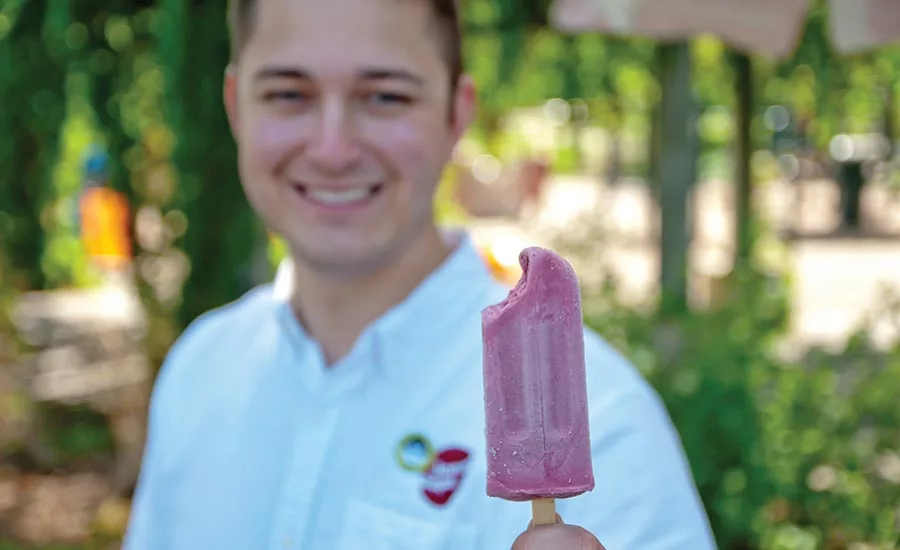 Man Holding A Jonny Pops Popsicle