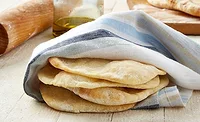 Slices of Flatbread Wrapped in Napkin