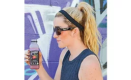 Teenage Girl Drinking Goodbelly Probiotics Beverage