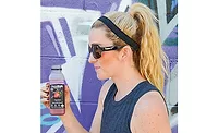 Teenage Girl Drinking Goodbelly Probiotics Beverage