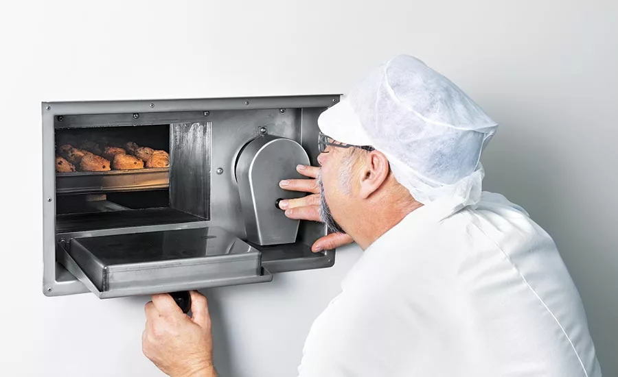 Baker Checking on Baked Goods