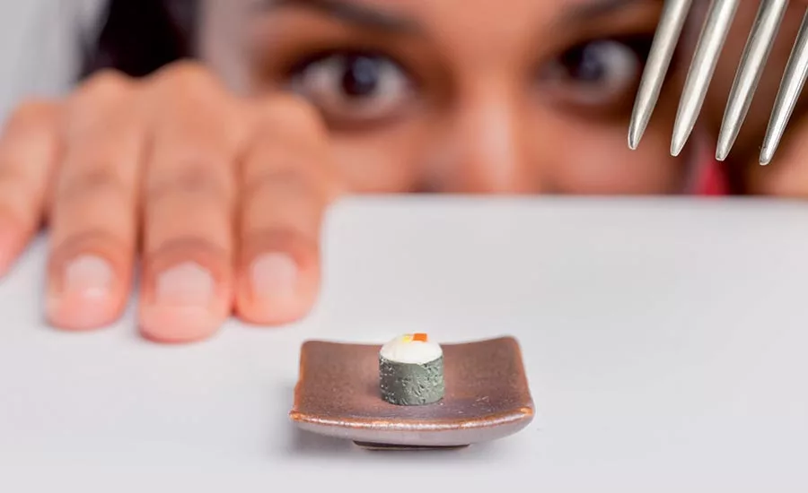 Woman Looking at Tiny Dessert