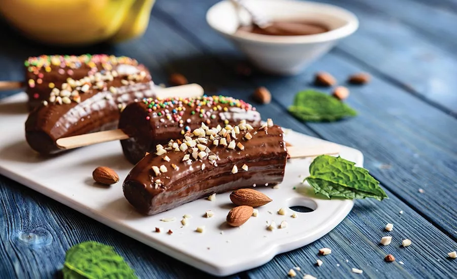 Chocolate Covered Bananas Topped with Nuts and Sprinkles