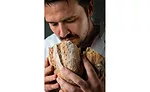 Man Sniffing Bread