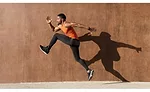 Man Running in Front of Wall