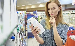 Woman reading label ingredients