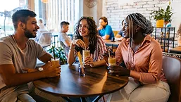 Group socializing in coffee shop