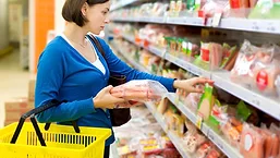 Women shopping at meat case