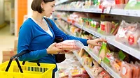 Women shopping at meat case