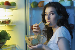 Woman snacking, refrigerator 