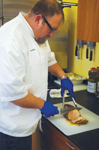 man slicing meat, safe meat