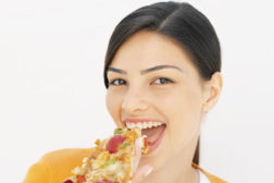 Lady eating Pizza