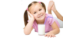 Little Girl Posing with Glass of Milk